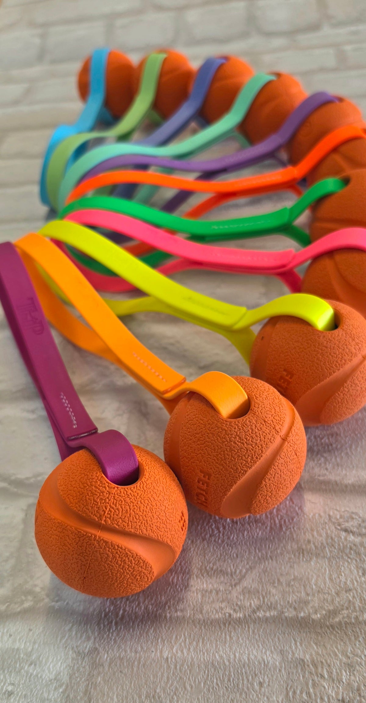 Chuck-It® Ball on Waterproof BioThane® Tug & Launcher Toy